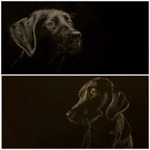 A piece of art - painting of a two black dogs.