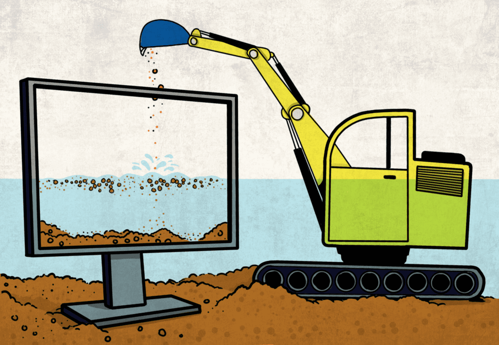 A mining excavator pours sediment into a computer screen.